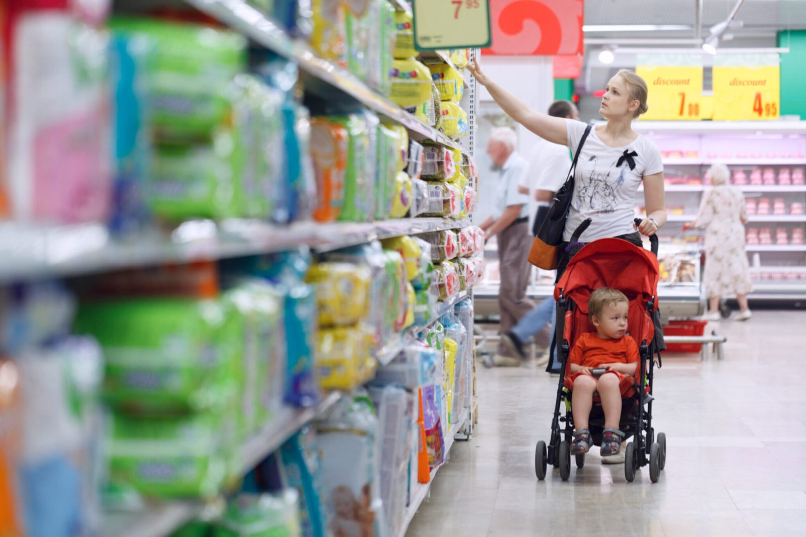 Mom and boy shopping for wipes