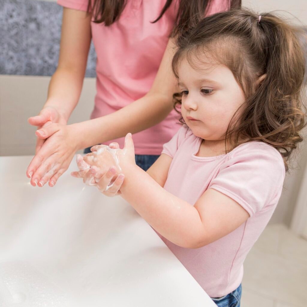 Girl washing hands